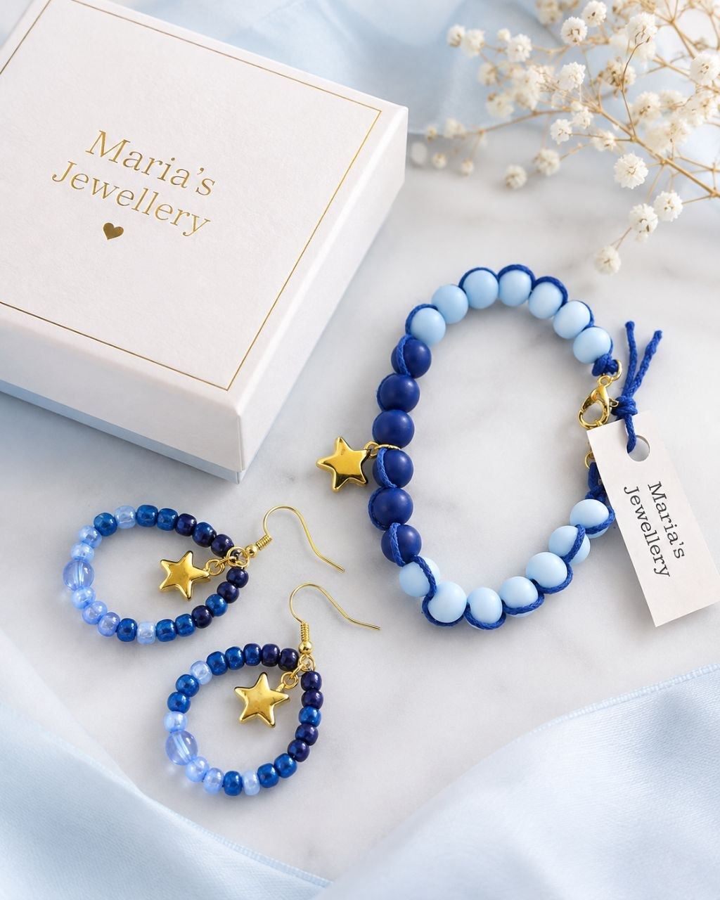 A MARIA’S set packed in its gift box with the hangtag
